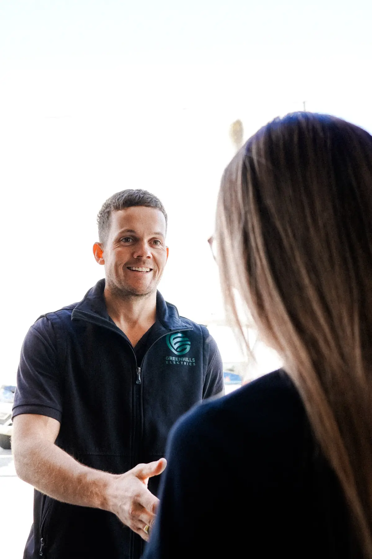 Greenhills Electrics electrician shaking hands with a happy customer